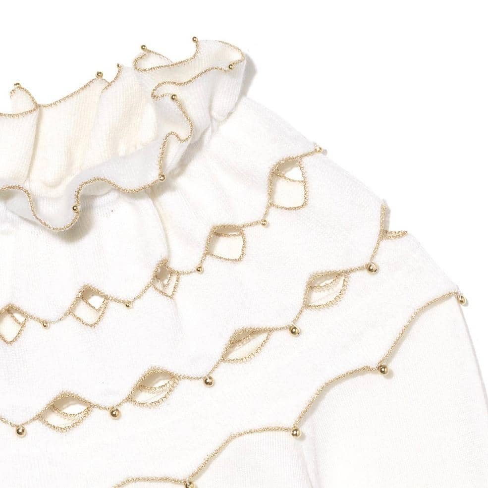 Detail of wisp cape / poncho, gold beads, ruffles