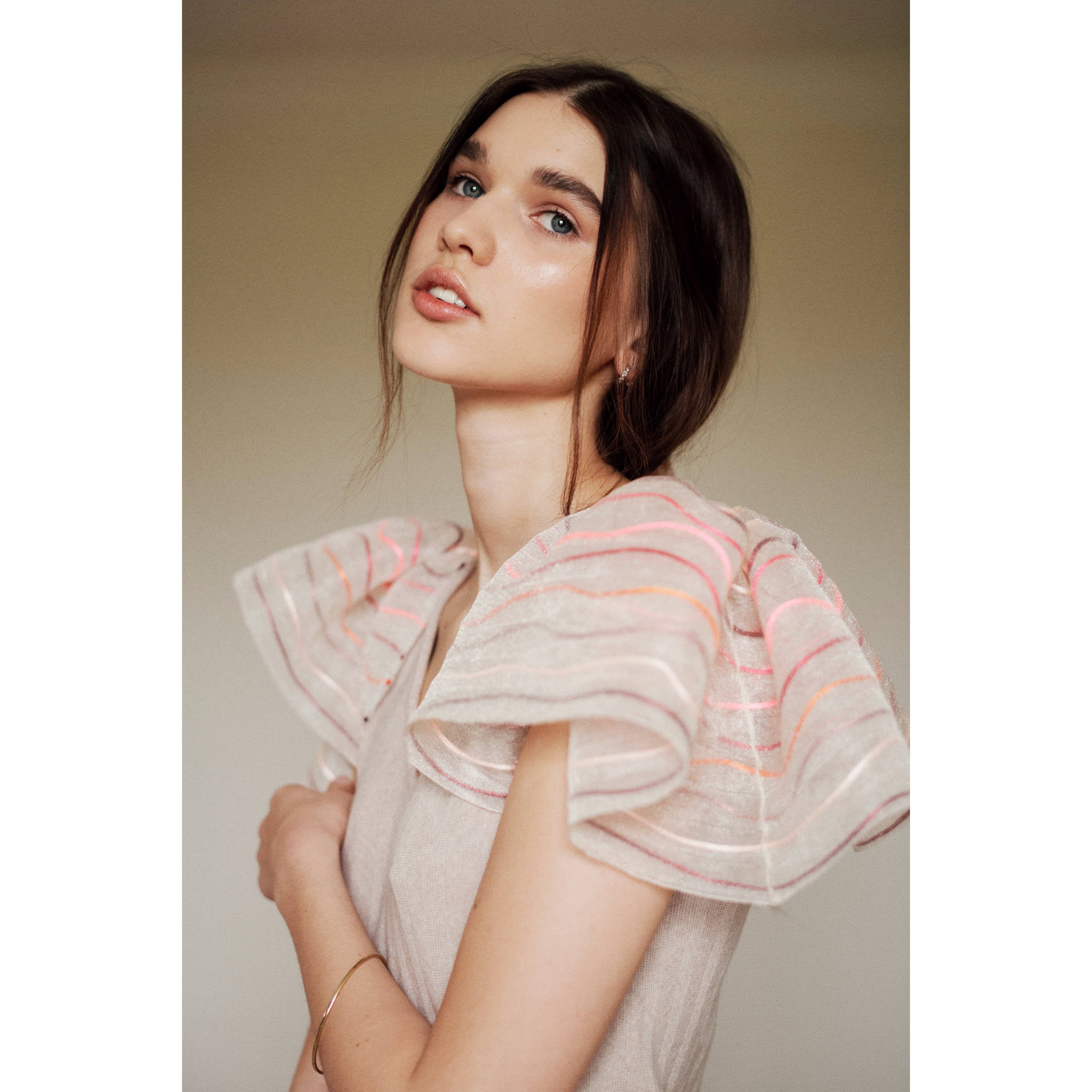 Model wearing Beige Calypso Top