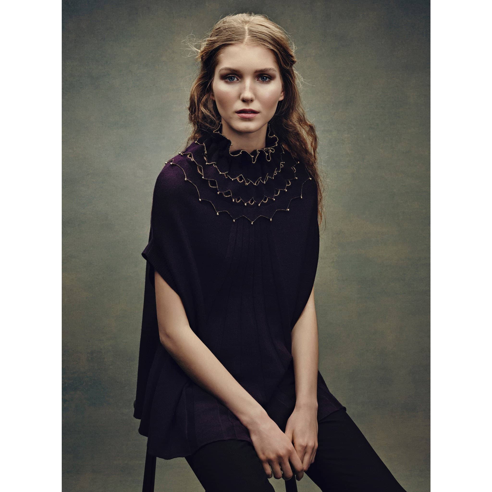 Model wearing mulberry ladies cape / poncho